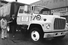 Jim Nelsen receiving the keys to a tractor purchased in the early 70's.