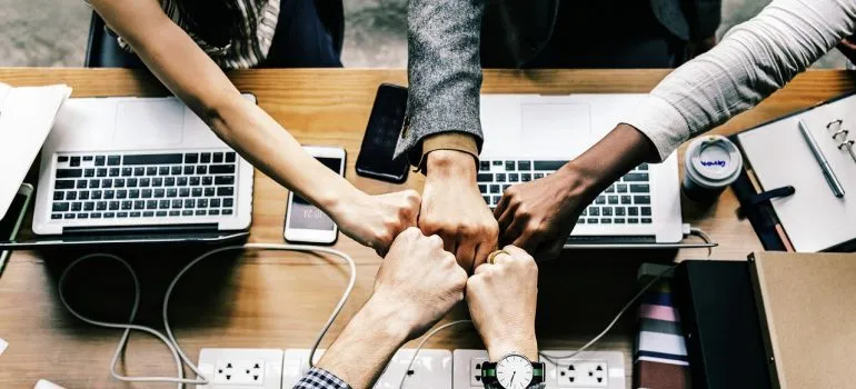 a team doing fist bump