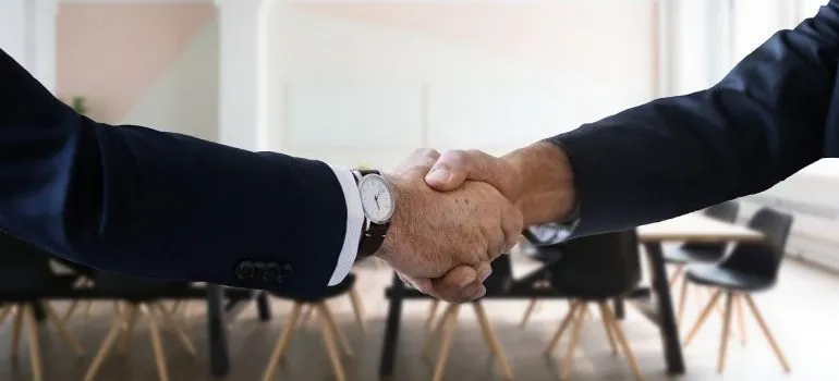 A handshake between two people.