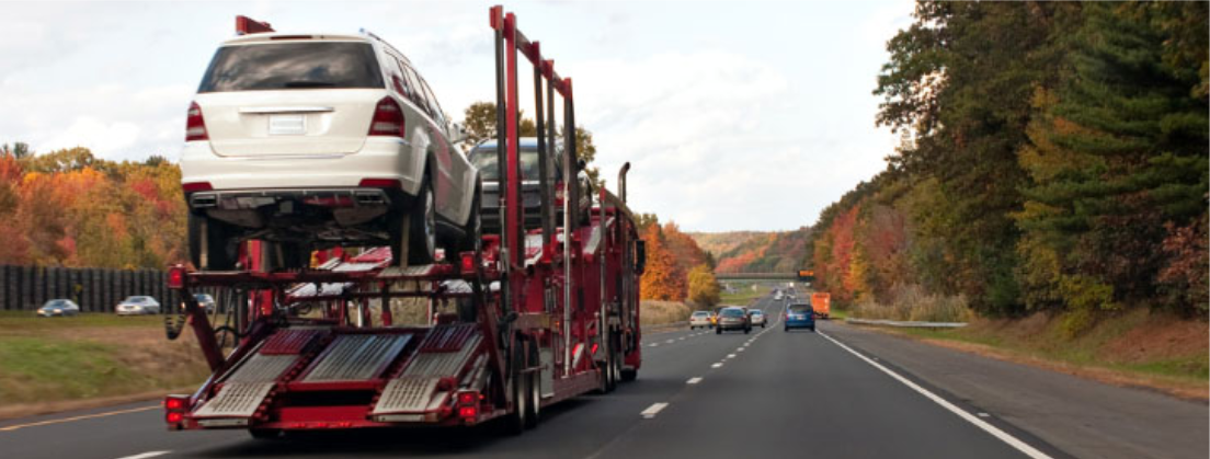 Open carrier for vehicles on a highway.