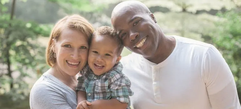 A happy family of three after being relocated by movers Kirkland WA. 