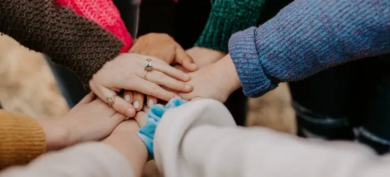 People gathering hands