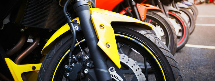 Close-up image of several motorcycles in a row.
