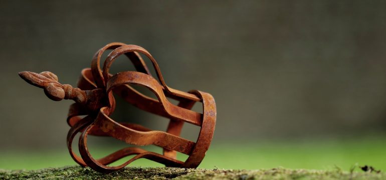 A rusted crown-like metal object
