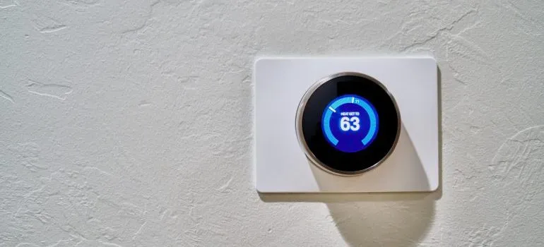 A white thermostat- a benefit of short term storage rental is that they are climate-controlled