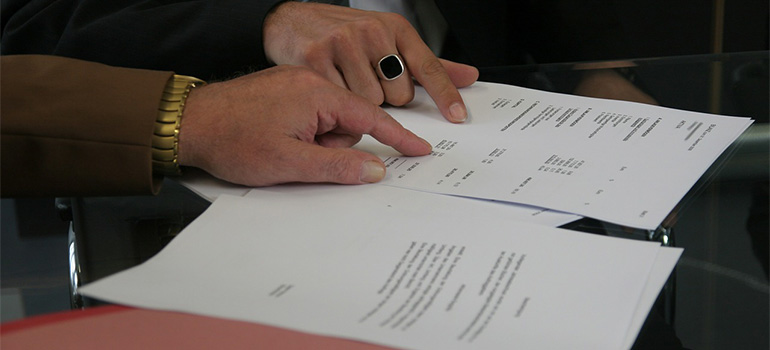 Two people going over a contract