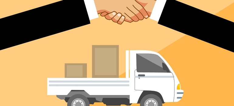 Shaking hand in front of a truck