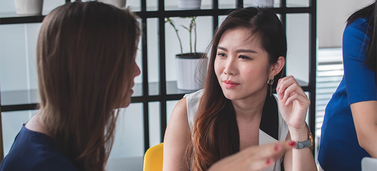 Two women speaking