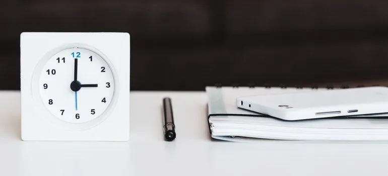 Clock on a desk of someone planning for moving to Bothell WA.