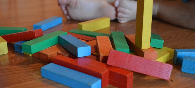 a pile of colorful wooden toys