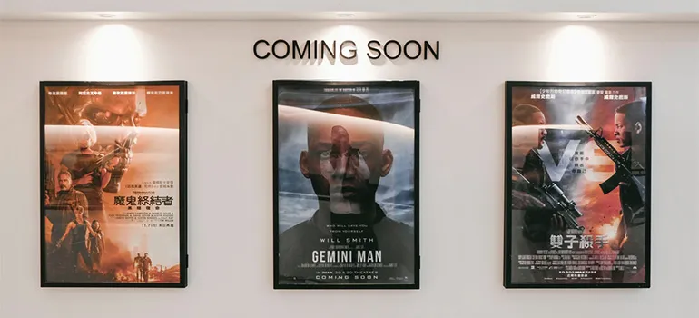 Movie posters in a cinema