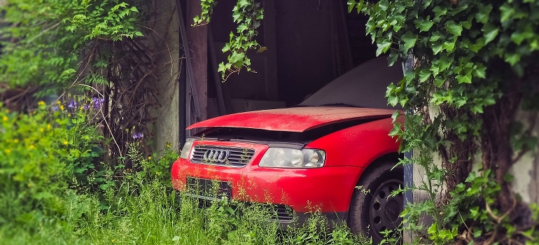 an abandoned car in a garage