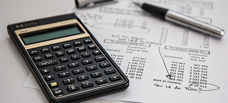 A calculator, some calculations and a pen