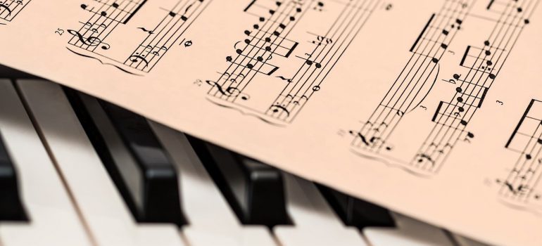 A sheet of music on a piano.