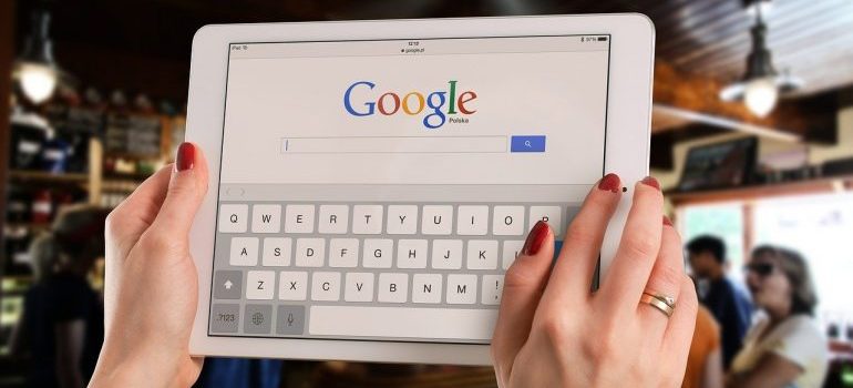 A woman using Google to find a good storage facility.
