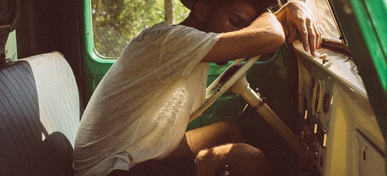 tired man behind the wheel