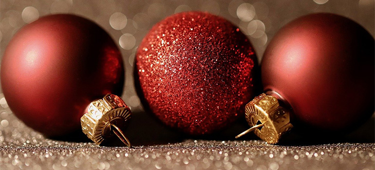 Three red Christmas tree ornaments