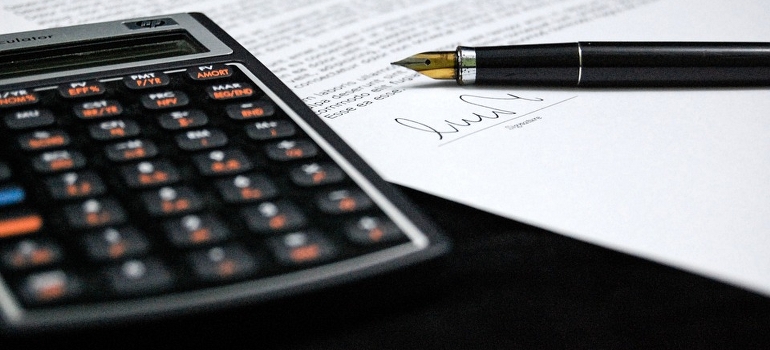 a calculator and a pen