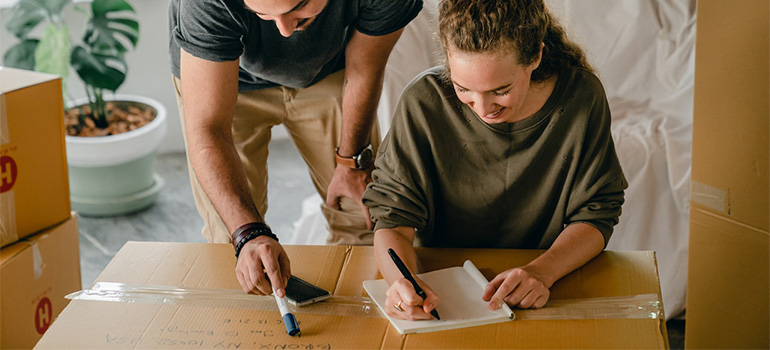 A couple trying to create a moving inventory list.
