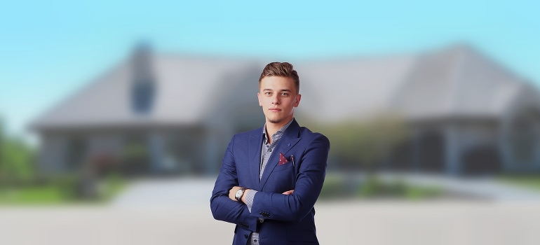 a realtor in front of a home