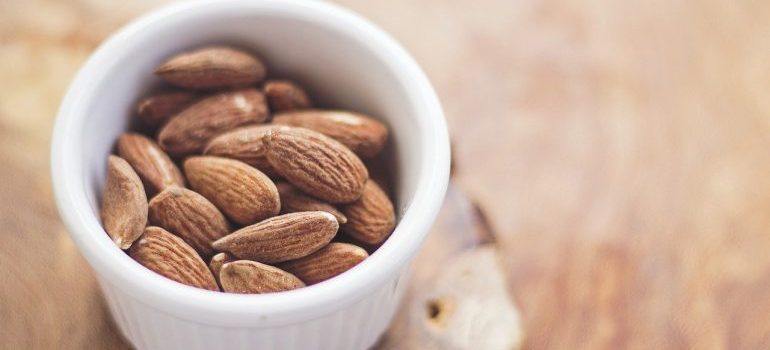 A cup full of almonds.
