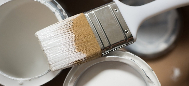 pain brush and paint cans