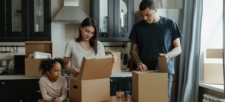 A family unpacking boxes.