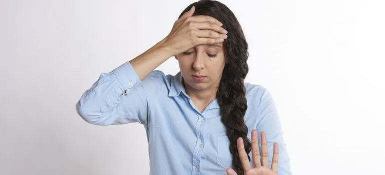 An upset woman, worried about making the moving process faster.