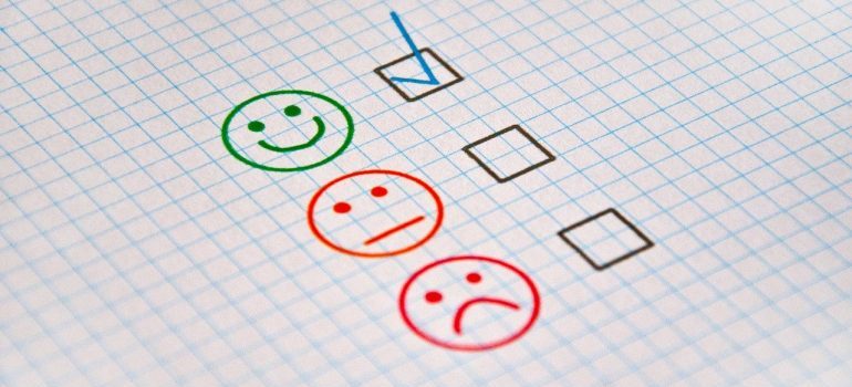 Three smiley faces and a checkmark next to the first one.
