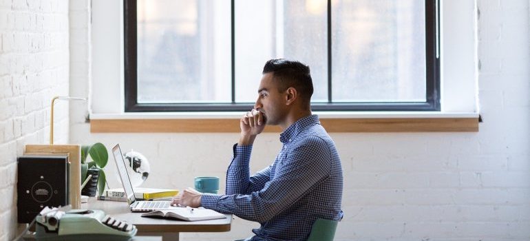 A man conducting online research about moving from Seattle to Newcastle.