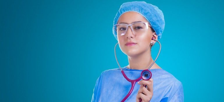 A nurse holding a stethoscope.