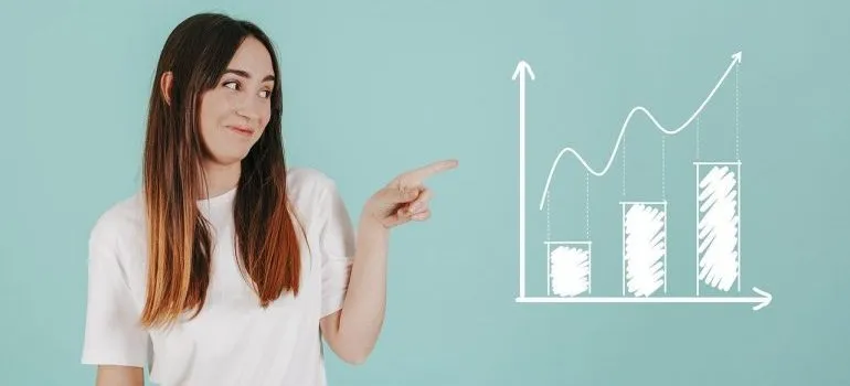 A woman pointing to a chart.