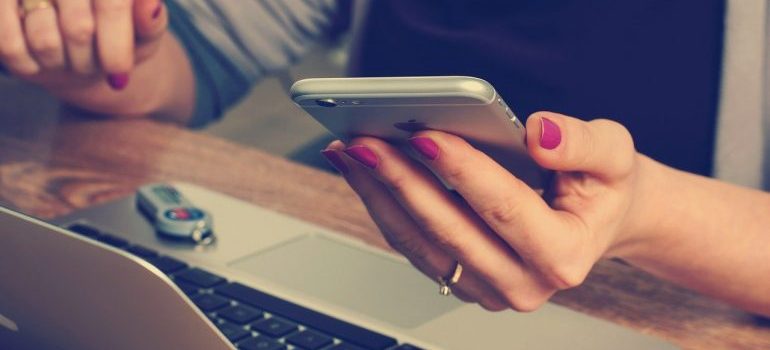 A woman holding a phone.