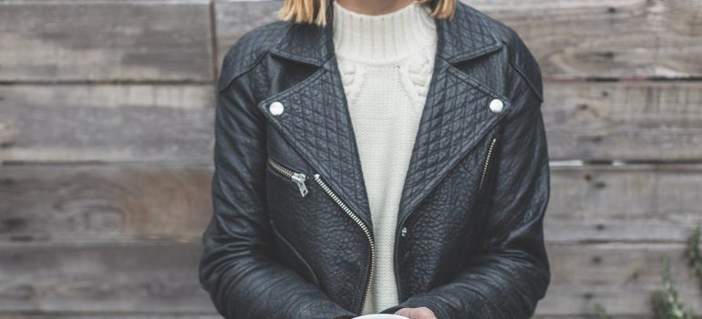 A woman in a leather jacket.