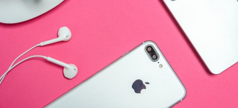 A pink surface with gadgets on it.