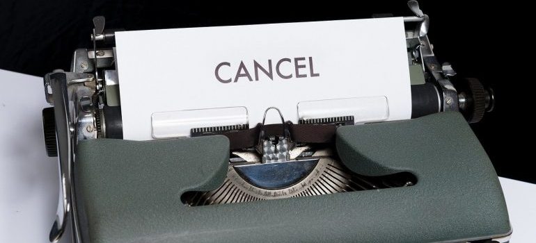 A paper with the word cancel coming out of a typewriter.