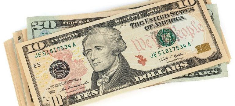 Dollar bills to save after moving off-grid.