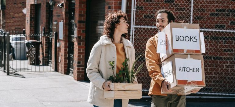 Couple decluttering and following minimalist moving tips