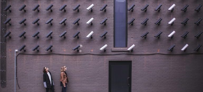 A wall of security cameras
