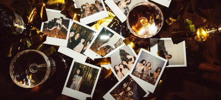 Polaroid photos among wine glasses
