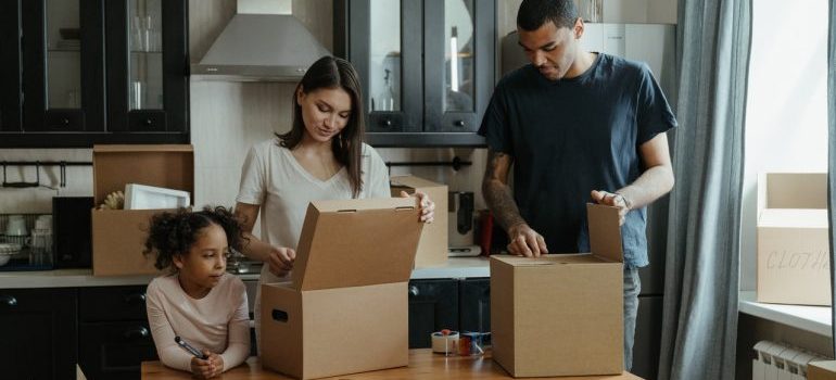 Family unpacking after moving from Seattle to Dallas