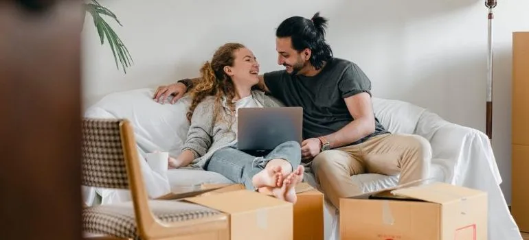 a couple lounging on a sofa