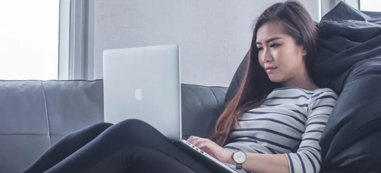 woman doing research on moving from Anchorage to Seattle