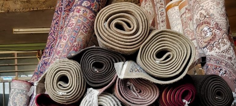 rolled-up rugs and carpets