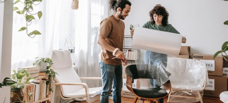 Couple learning how to prepare large appliances for self storage