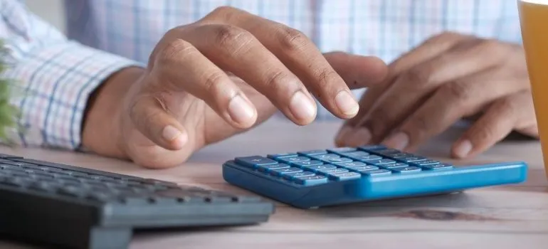 man using a calculator