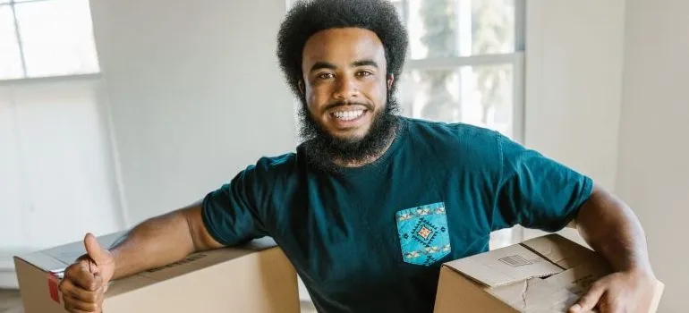 a professional mover, giving a thumbs up