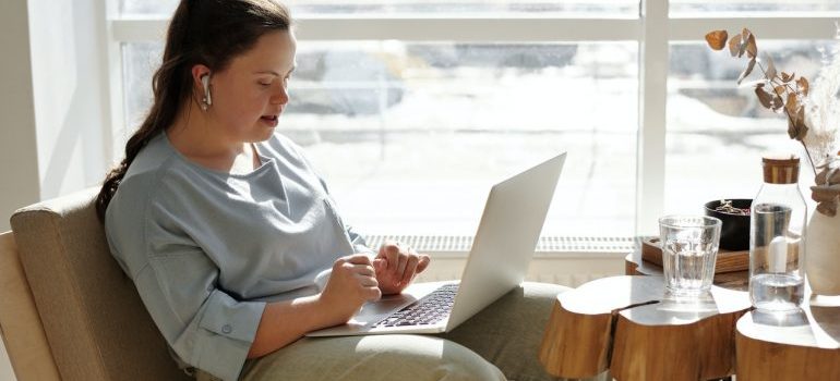 Woman reading moving tips for people with disabilities