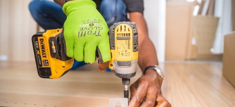 The man works with a tool.