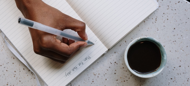 a person writing a chedule
